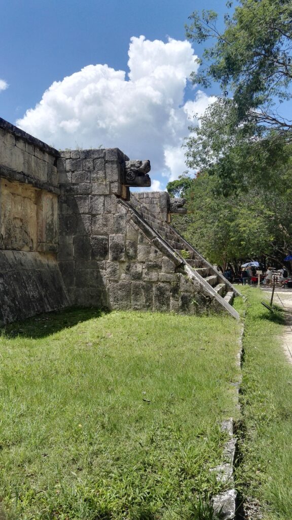 Maya ruins stairs reaching up decorated with animal like heads